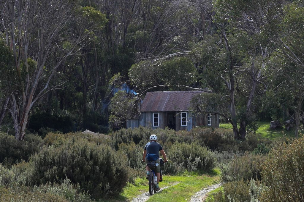 Bikepacking rider approaching Horse Camp Hut