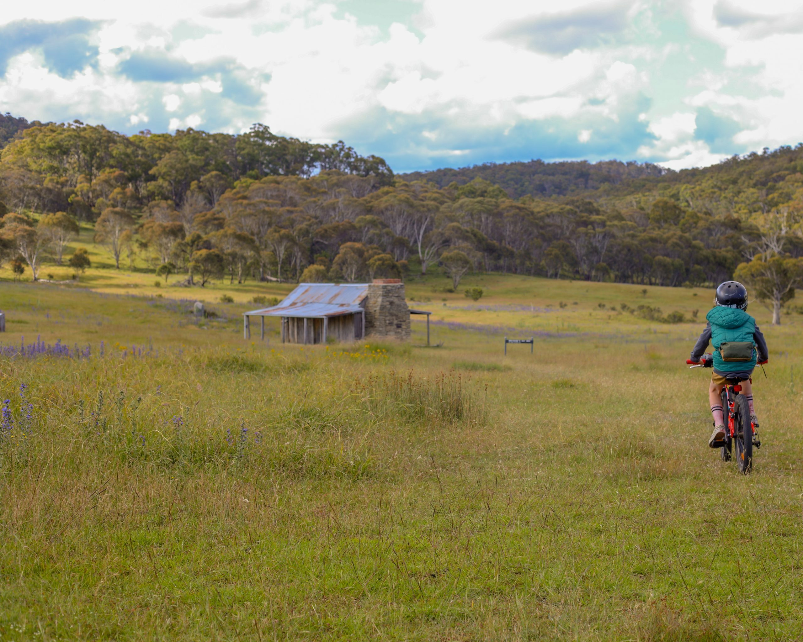 Bikepacking with a six year old, riding towards a historic hut