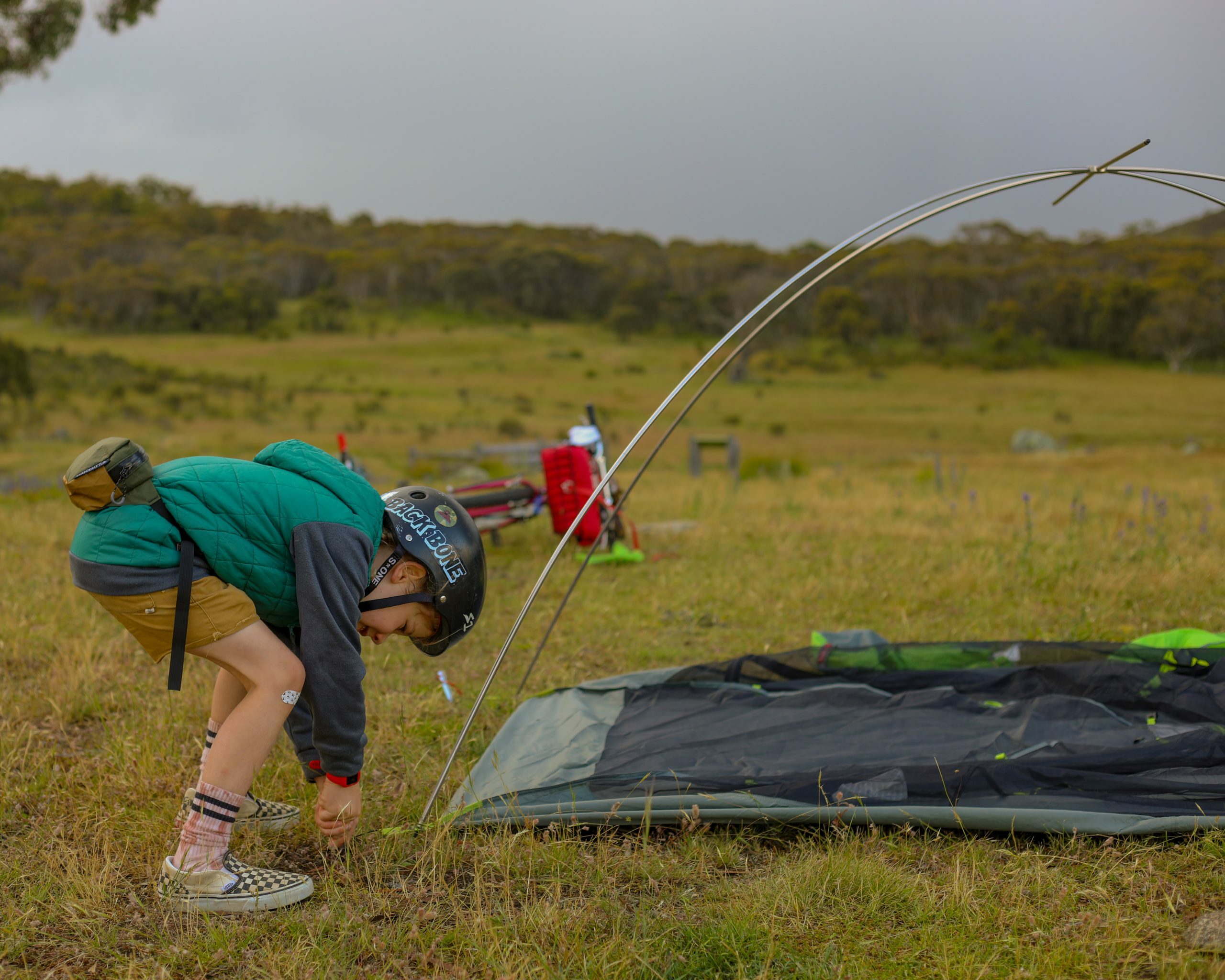 Bikepacking with a six year old, helping to put up the tent