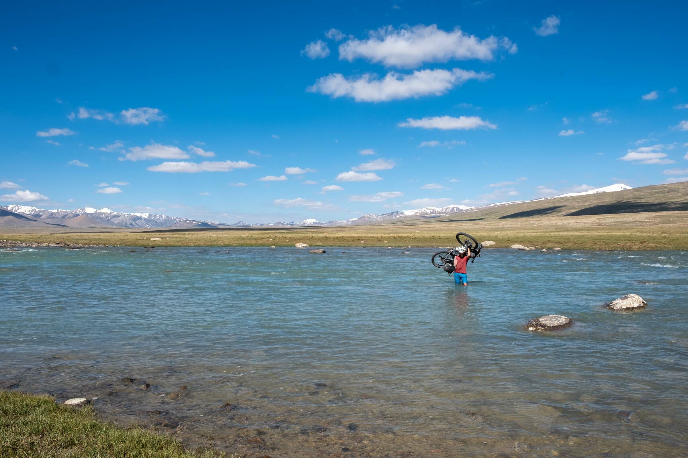 River crossing while bikepacking in Kyrgyzstan