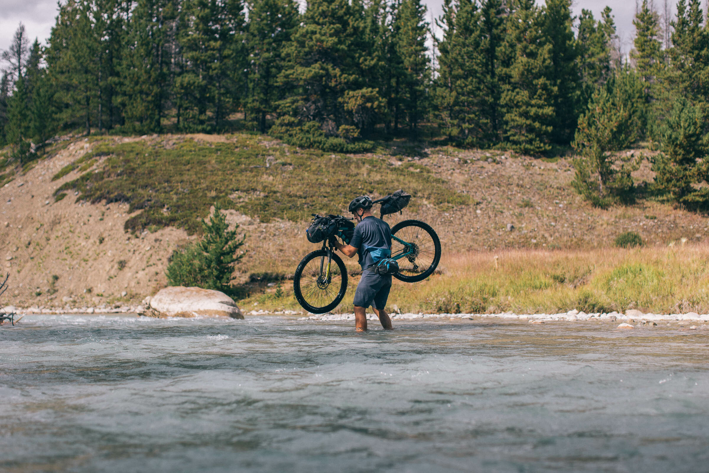 River crossing with a bicycle in Canada, photo by Miles Arbour